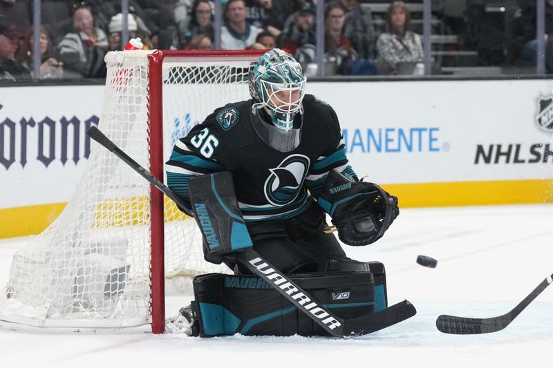 Feb 17, 2024; San Jose, California, USA; San Jose Sharks goaltender Kaapo Kahkonen (36) makes a save against the Columbus Blue Jackets during the first period at SAP Center at San Jose. Mandatory Credit: Darren Yamashita-USA TODAY Sports