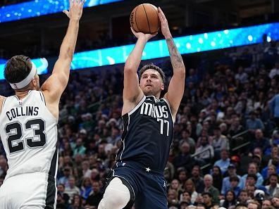 DALLAS, TX - DECEMBER 23: Luka Doncic #77 of the Dallas Mavericks shoots the ball during the game against the San Antonio Spurs on December 23, 2023 at the American Airlines Center in Dallas, Texas. NOTE TO USER: User expressly acknowledges and agrees that, by downloading and or using this photograph, User is consenting to the terms and conditions of the Getty Images License Agreement. Mandatory Copyright Notice: Copyright 2023 NBAE (Photo by Glenn James/NBAE via Getty Images)