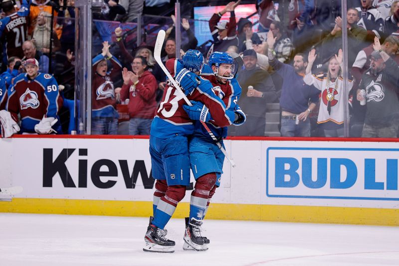 Nov 7, 2023; Denver, Colorado, USA; Colorado Avalanche left wing Miles Wood (28) celebrates his goal with right wing Valeri Nichushkin (13) in the second period against the New Jersey Devils at Ball Arena. Mandatory Credit: Isaiah J. Downing-USA TODAY Sports