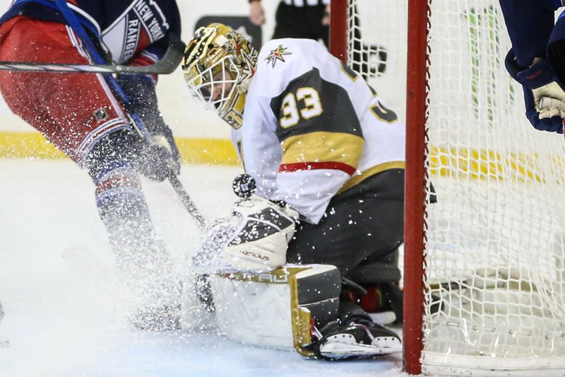 Jan 26, 2024; New York, New York, USA; Vegas Golden Knights goaltender Adin Hill (33) makes a save on a shot on goal attempt in the second period against the New York Rangers at Madison Square Garden. Mandatory Credit: Wendell Cruz-USA TODAY Sports