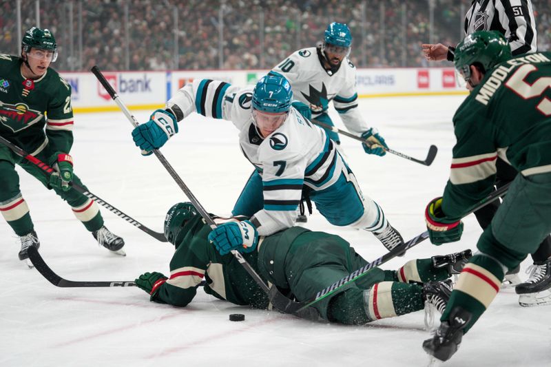 Mar 3, 2024; Saint Paul, Minnesota, USA; San Jose Sharks center Nico Sturm (7) trips Minnesota Wild center Mason Shaw (15) during a face-off in the first period at Xcel Energy Center. Mandatory Credit: Matt Blewett-USA TODAY Sports