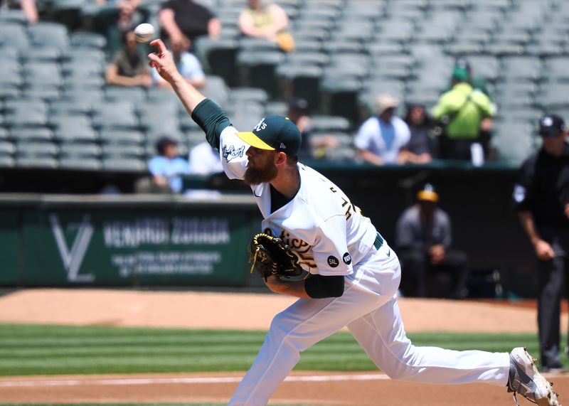 Jun 15, 2023; Oakland, California, USA; Oakland Athletics starting pitcher Paul Blackburn (58) pitches the ball against the Tampa Bay Rays during the first inning at Oakland-Alameda County Coliseum. Mandatory Credit: Kelley L Cox-USA TODAY Sports