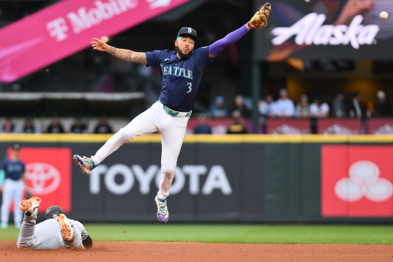 Jun 11, 2024; Seattle, Washington, USA; Seattle Mariners shortstop J.P. Crawford (3) misses the throw to second base while Chicago White Sox designated hitter Korey Lee (26) is safe with a stolen base during the third inning at T-Mobile Park. Mandatory Credit: Steven Bisig-USA TODAY Sports