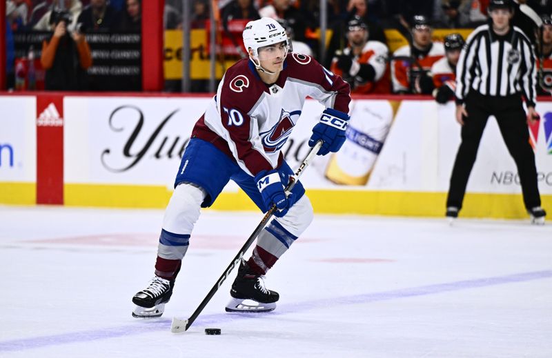 Jan 20, 2024; Philadelphia, Pennsylvania, USA; Colorado Avalanche defenseman Sam Malinski (70) controls the puck against the Philadelphia Flyers in the first period at Wells Fargo Center. Mandatory Credit: Kyle Ross-USA TODAY Sports