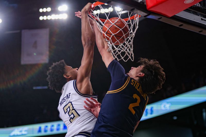 Feb 15, 2025; Atlanta, Georgia, USA; Georgia Tech Yellow Jackets guard Jaeden Mustaf (3) dunks over California Golden Bears guard Andrej Stojakovic (2) in the second half at McCamish Pavilion. Mandatory Credit: Brett Davis-Imagn Images