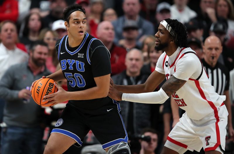 Jan 20, 2024; Lubbock, Texas, USA;  Brigham Young Cougars center Aly Khalifa (50) works the ball against Texas Tech Red Raiders center Warren Washington (22) in the first half at United Supermarkets Arena. Mandatory Credit: Michael C. Johnson-USA TODAY Sports