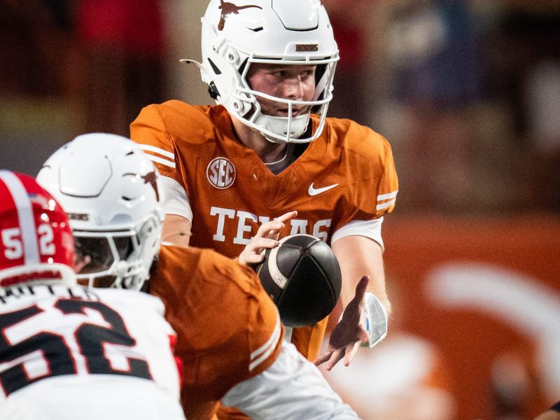 Oct 19, 2024; Austin, Texas, USA; Texas Longhorns quarterback Quinn Ewers (3) takes a snap against the Georgia Bulldogs in the first quarter at Darrell K. Royal Texas Memorial Stadium. Mandatory Credit: Sara Diggins/USA TODAY Network via Imagn Images