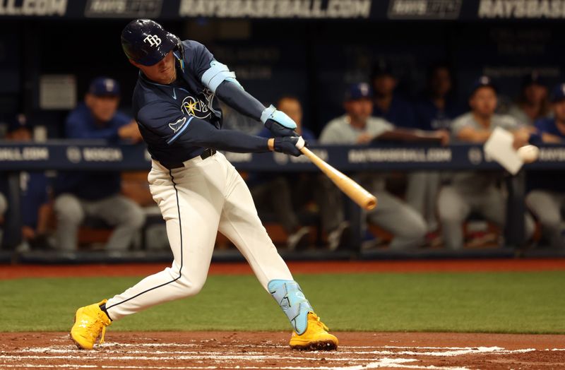 Apr 2, 2024; St. Petersburg, Florida, USA; Tampa Bay Rays second baseman Curtis Mead (25) singles during the second inning against the Texas Rangers at Tropicana Field. Mandatory Credit: Kim Klement Neitzel-USA TODAY Sports