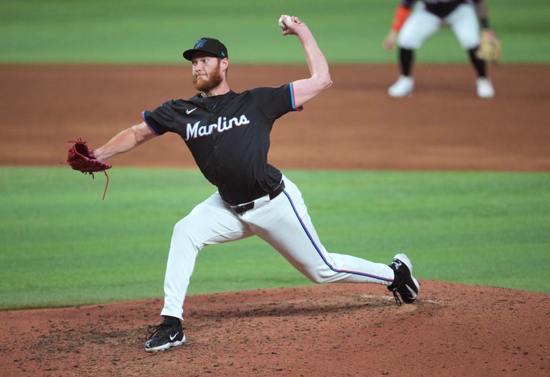 May 31, 2024; Miami, Florida, USA;  Miami Marlins pitcher A.J. Puk (35) pitches against the Texas Rangers in the seventh inning at loanDepot Park. Mandatory Credit: Jim Rassol-USA TODAY Sports