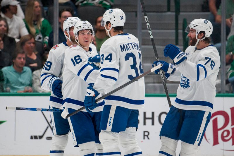 Oct 26, 2023; Dallas, Texas, USA; Toronto Maple Leafs right wing Mitchell Marner (16) and center Calle Jarnkrok (19) and center Auston Matthews (34) and defenseman TJ Brodie (78) celebrates a goal scored by Marner against the Dallas Stars during the second period at the American Airlines Center. Mandatory Credit: Jerome Miron-USA TODAY Sports