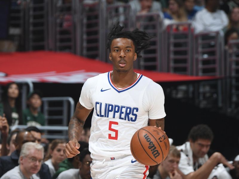 LOS ANGELES, CA - MARCH 10: Bones Hyland #5 of the LA Clippers dribbles the ball during the game against the Milwaukee Bucks on March 10, 2024 at Crypto.Com Arena in Los Angeles, California. NOTE TO USER: User expressly acknowledges and agrees that, by downloading and/or using this Photograph, user is consenting to the terms and conditions of the Getty Images License Agreement. Mandatory Copyright Notice: Copyright 2024 NBAE (Photo by Andrew D. Bernstein/NBAE via Getty Images)