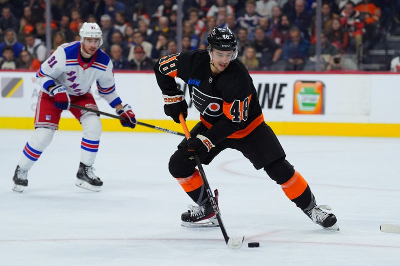 Nov 29, 2024; Philadelphia, Pennsylvania, USA; Philadelphia Flyers center Morgan Frost (48) controls the puck against the New York Rangers in the second period at Wells Fargo Center. Mandatory Credit: Kyle Ross-Imagn Images