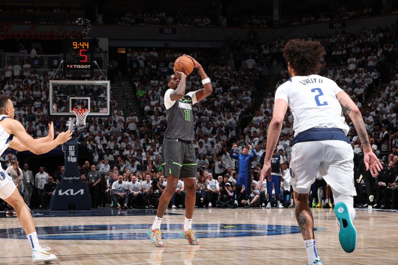 MINNEAPOLIS, MN - MAY 30: Naz Reid #11 of the Minnesota Timberwolves shoots a three point basket during the game  against the Dallas Mavericks during Game 5 of the Western Conference Finals during the 2024 NBA Playoffs on May 30, 2024 at Target Center in Minneapolis, Minnesota. NOTE TO USER: User expressly acknowledges and agrees that, by downloading and or using this Photograph, user is consenting to the terms and conditions of the Getty Images License Agreement. Mandatory Copyright Notice: Copyright 2024 NBAE (Photo by David Sherman/NBAE via Getty Images)