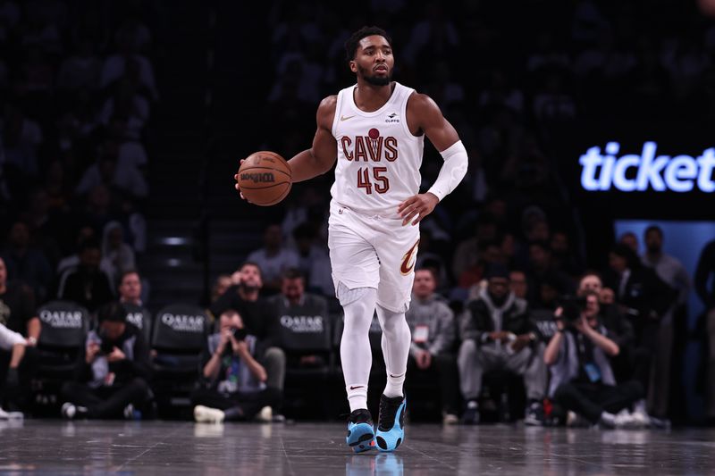 NEW YORK, NEW YORK - OCTOBER 25: Donovan Mitchell #45 of the Cleveland Cavaliers brings the ball up the court during the third quarter of the game against the Brooklyn Nets at Barclays Center on October 25, 2023 in New York City. NOTE TO USER: User expressly acknowledges and agrees that, by downloading and or using this photograph, User is consenting to the terms and conditions of the Getty Images License Agreement. (Photo by Dustin Satloff/Getty Images)