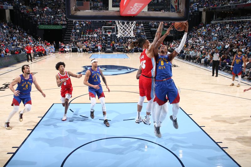 MEMPHIS, TN - NOVEMBER 17: Peyton Watson #8 of the Denver Nuggets shoots the ball during the game against the Memphis Grizzlies on November 17, 2024 at FedExForum in Memphis, Tennessee. NOTE TO USER: User expressly acknowledges and agrees that, by downloading and or using this photograph, User is consenting to the terms and conditions of the Getty Images License Agreement. Mandatory Copyright Notice: Copyright 2024 NBAE (Photo by Joe Murphy/NBAE via Getty Images)