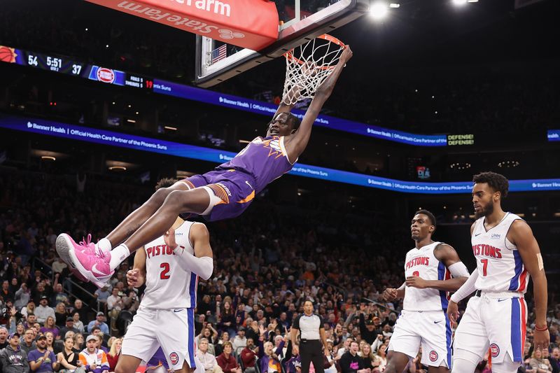 PHOENIX, ARIZONA - FEBRUARY 14:  Bol Bol #11 of the Phoenix Suns slam dunks the ball against the Detroit Pistons during the first half of the NBA game at Footprint Center on February 14, 2024 in Phoenix, Arizona. NOTE TO USER: User expressly acknowledges and agrees that, by downloading and or using this photograph, User is consenting to the terms and conditions of the Getty Images License Agreement.  (Photo by Christian Petersen/Getty Images)