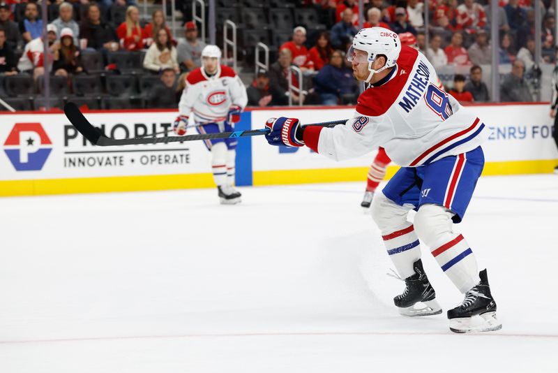 Oct 9, 2025; Detroit, Michigan, USA;  Montréal Canadiens defenseman Mike Matheson (8) takes a shot in the first period against the Detroit Red Wings at Little Caesars Arena. Mandatory Credit: Rick Osentoski-Imagn Images