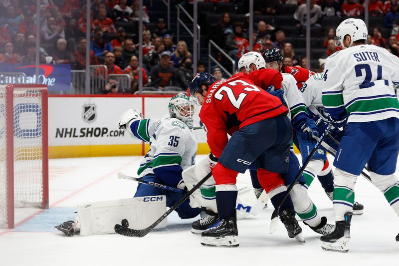 Feb 11, 2024; Washington, District of Columbia, USA; Vancouver Canucks goaltender Thatcher Demko (35) makes a save on Washington Capitals center Michael Sgarbossa (23) in the third period at Capital One Arena. Mandatory Credit: Geoff Burke-USA TODAY Sports