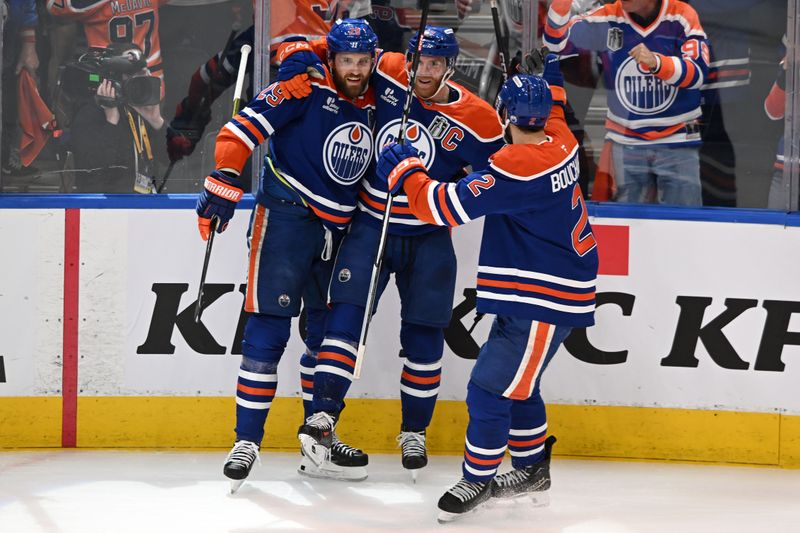Jun 6, 2025; Edmonton, Alberta, CAN; Edmonton Oilers center Leon Draisaitl (29) reacts with center Connor McDavid (97) and defenseman Evan Bouchard (2) after scoring a goal against the Florida Panthers during the first period in game two of the 2025 Stanley Cup Final at Rogers Place. Mandatory Credit: Walter Tychnowicz-Imagn Images