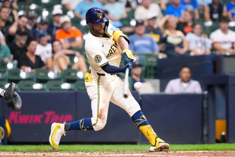 Aug 27, 2024; Milwaukee, Wisconsin, USA;  Milwaukee Brewers left fielder Jackson Chourio (11) hits a home run during the third inning against the San Francisco Giants at American Family Field. Mandatory Credit: Jeff Hanisch-USA TODAY Sports