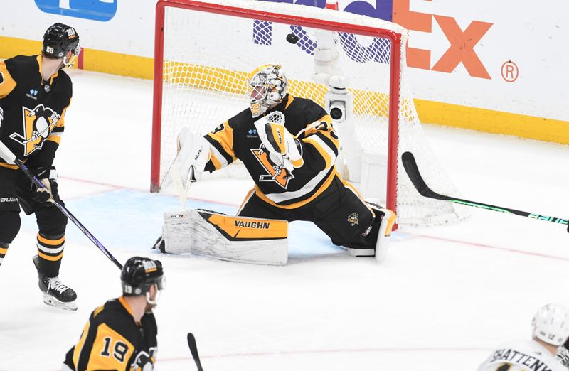 Apr 13, 2024; Pittsburgh, Pennsylvania, USA; Boston Bruins defenseman Kevin Shattenkirk (12) scores on Pittsburgh Penguins goalie Tristan Jarry (35) during the second period at PPG Paints Arena. Mandatory Credit: Philip G. Pavely-USA TODAY Sports