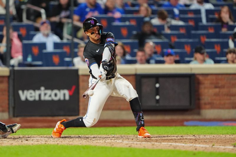 May 31, 2024; New York City, New York, USA; New York Mets third baseman Mark Vientos (27) hits a single against the Arizona Diamondbacks during the sixth inning at Citi Field. Mandatory Credit: Gregory Fisher-USA TODAY Sports