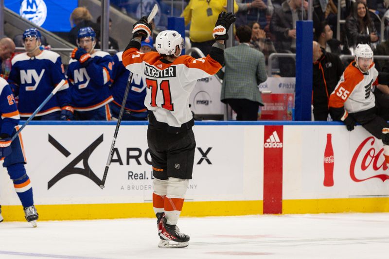 Nov 25, 2023; Elmont, New York, USA; Philadelphia Flyers right wing Tyson Foerster (71) celebrates the win against the New York Islanders at UBS Arena. Mandatory Credit: Thomas Salus-USA TODAY Sports