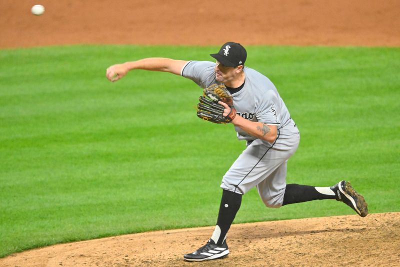 Apr 10, 2024; Cleveland, Ohio, USA; Chicago White Sox pitcher Bryan Shaw (27) delivers a pitch in the tenth inning against the Cleveland Guardians at Progressive Field. Mandatory Credit: David Richard-USA TODAY Sports