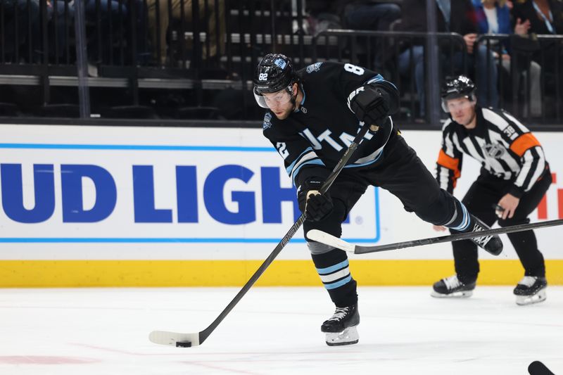 Nov 15, 2024; Salt Lake City, Utah, USA; Utah Hockey Club center Nick Schmaltz (8) takes a shot during a power playagainst the Vegas Golden Knights during the second period at Delta Center. Mandatory Credit: Rob Gray-Imagn Images