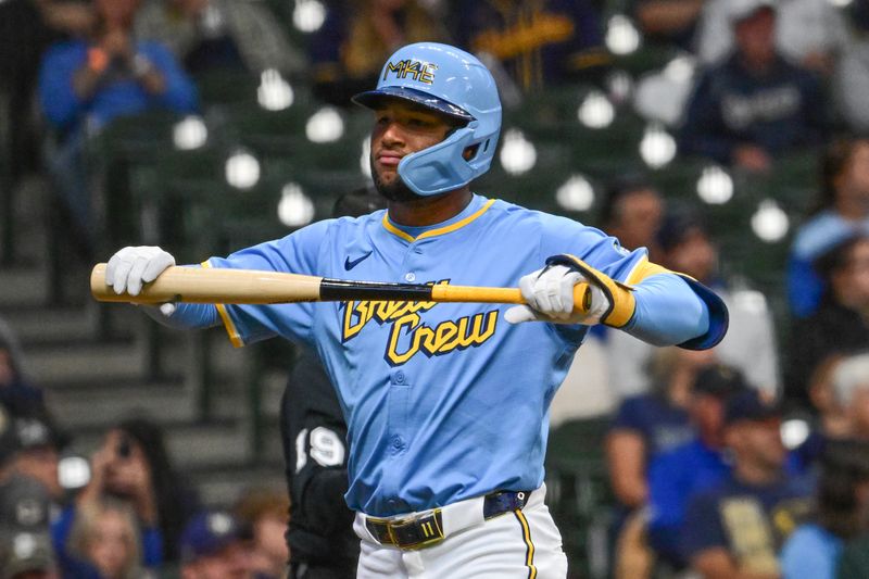 Sep 6, 2024; Milwaukee, Wisconsin, USA;  Milwaukee Brewers left fielder Jackson Chourio (11) reacts after striking out in the third inning against the Colorado Rockies at American Family Field. Mandatory Credit: Benny Sieu-Imagn Images