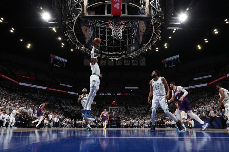 MINNEAPOLIS, MN -  APRIL 23: Jaden McDaniels #3 of the Minnesota Timberwolves grabs the rebound during the game against the Phoenix Suns during Round One Game Two of the 2024 NBA Playoffs on April 23, 2024 at Target Center in Minneapolis, Minnesota. NOTE TO USER: User expressly acknowledges and agrees that, by downloading and or using this Photograph, user is consenting to the terms and conditions of the Getty Images License Agreement. Mandatory Copyright Notice: Copyright 2024 NBAE (Photo by Jordan Johnson/NBAE via Getty Images)