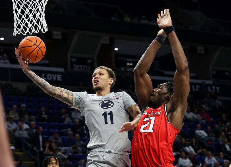 Feb 18, 2026; University Park, Pennsylvania, USA; Penn State Nittany Lions guard Eli Rice (11) drives the ball to the basket during the first half against the Rutgers Scarlet Knights at Bryce Jordan Center. Mandatory Credit: Matthew O'Haren-Imagn Images