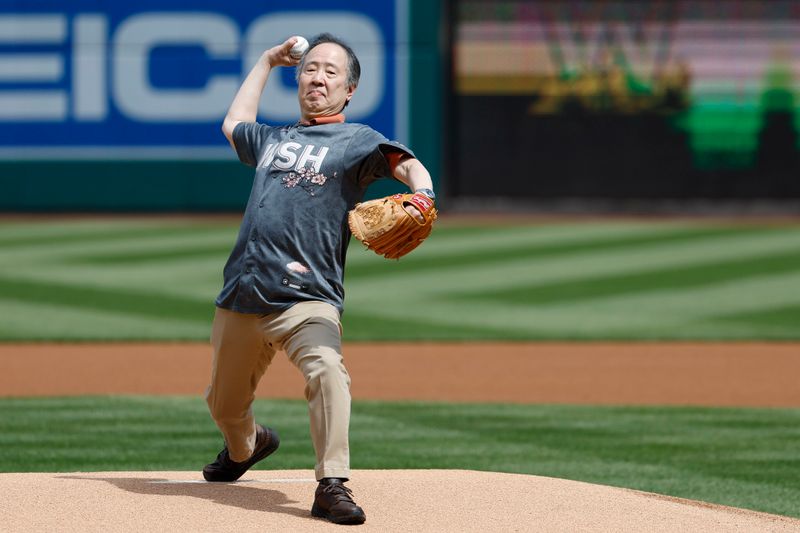 Apr 5, 2023; Washington, District of Columbia, USA; Ambassador of Japan to the United States Koji Tomita throws out the ceremonial first pitch as part of Blossoms & Baseball: National Cherry Blossom Celebration prior to the game between the Washington Nationals and the Tampa Bay Rays at Nationals Park. Mandatory Credit: Geoff Burke-USA TODAY Sports