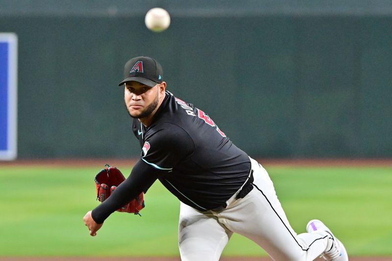 Sep 23, 2024; Phoenix, Arizona, USA;  Arizona Diamondbacks pitcher Eduardo Rodriguez (57) throws in the first inning against the San Francisco Giants at Chase Field. Mandatory Credit: Matt Kartozian-Imagn Images