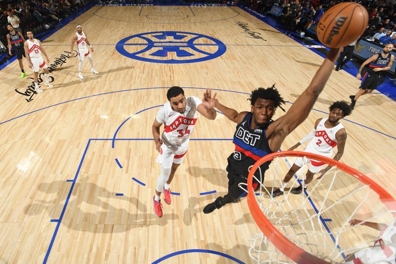 DETROIT, MI - MARCH 13: James Wiseman #13 of the Detroit Pistons drives to the basket during the game against the Toronto Raptors  on March 13, 2024 at Little Caesars Arena in Detroit, Michigan. NOTE TO USER: User expressly acknowledges and agrees that, by downloading and/or using this photograph, User is consenting to the terms and conditions of the Getty Images License Agreement. Mandatory Copyright Notice: Copyright 2024 NBAE (Photo by Chris Schwegler/NBAE via Getty Images)