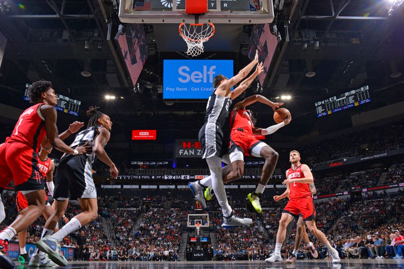 SAN ANTONIO, TX - MARCH 12: Jalen Green #4 of the Houston Rockets drives to the basket during the game against the San Antonio Spurs on March 12, 2024 at the Frost Bank Center in San Antonio, Texas. NOTE TO USER: User expressly acknowledges and agrees that, by downloading and or using this photograph, user is consenting to the terms and conditions of the Getty Images License Agreement. Mandatory Copyright Notice: Copyright 2024 NBAE (Photos by Jesse D. Garrabrant/NBAE via Getty Images)