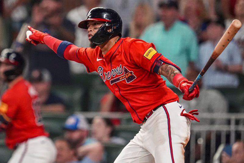 Aug 2, 2024; Cumberland, Georgia, USA; Atlanta Braves shortstop Orlando Arcia (11) reacts after hitting a single to drive in a run against the Miami Marlins during the eighth inning at Truist Park. Mandatory Credit: Dale Zanine-USA TODAY Sports