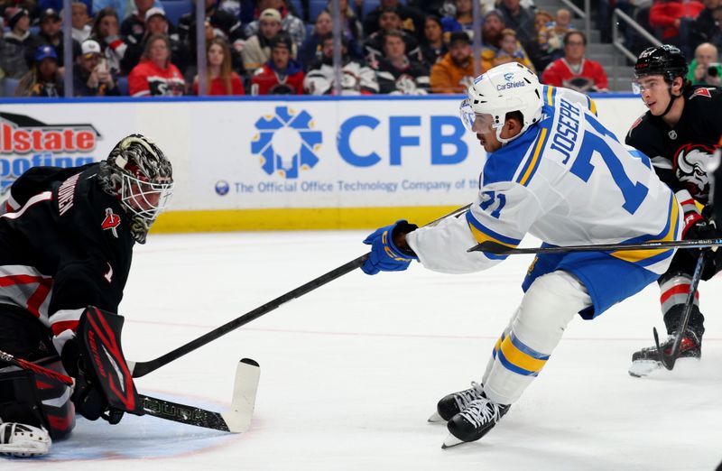 Nov 6, 2025; Buffalo, New York, USA;  St. Louis Blues right wing Mathieu Joseph (71) scores a shorthanded goal on Buffalo Sabres goaltender Ukko-Pekka Luukkonen (1) during the first period at KeyBank Center. Mandatory Credit: Timothy T. Ludwig-Imagn Images