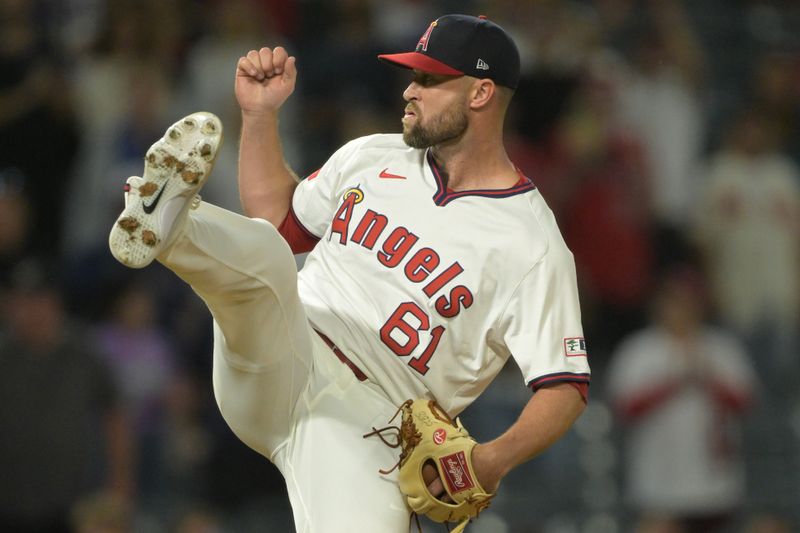 Jul 30, 2024; Anaheim, California, USA; Los Angeles Angels relief pitcher Hunter Strickland (61) earns a save in the ninth inning against the Colorado Rockies at Angel Stadium. Mandatory Credit: Jayne Kamin-Oncea-USA TODAY Sports