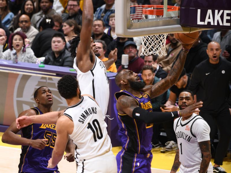 LOS ANGELES, CA - JANUARY 17: LeBron James #23 of the Los Angeles Lakers drives to the basket during the game against the Brooklyn Nets on January 17, 2025 at Crypto.Com Arena in Los Angeles, California. NOTE TO USER: User expressly acknowledges and agrees that, by downloading and/or using this Photograph, user is consenting to the terms and conditions of the Getty Images License Agreement. Mandatory Copyright Notice: Copyright 2025 NBAE (Photo by Adam Pantozzi/NBAE via Getty Images)