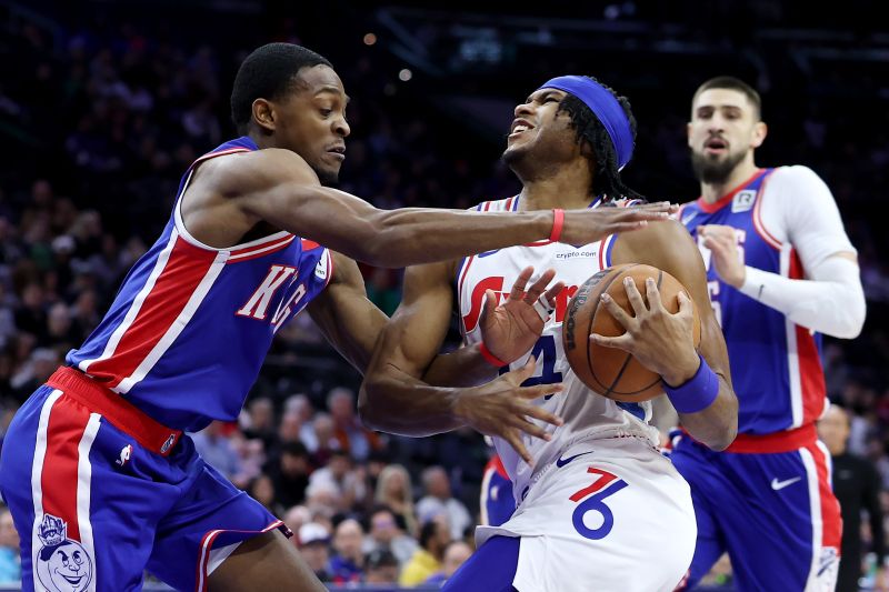 PHILADELPHIA, PENNSYLVANIA - JANUARY 29: Ricky Council IV #14 of the Philadelphia 76ers drives to the basket against De'Aaron Fox #5 of the Sacramento Kings during the first half at the Wells Fargo Center on January 29, 2025 in Philadelphia, Pennsylvania. NOTE TO USER: User expressly acknowledges and agrees that, by downloading and or using this photograph, User is consenting to the terms and conditions of the Getty Images License Agreement. (Photo by Emilee Chinn/Getty Images)