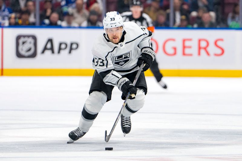 Mar 25, 2024; Vancouver, British Columbia, CAN; Los Angeles Kings forward Viktor Arvidsson (33) handles the puck against the Vancouver Canucks in the second period at Rogers Arena. Mandatory Credit: Bob Frid-USA TODAY Sports