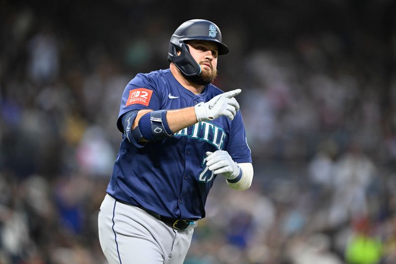 May 16, 2025; San Diego, California, USA; Seattle Mariners first baseman Rowdy Tellez (23) rounds the bases after hitting a two-run home run during fourth inning against the San Diego Padres at Petco Park. Mandatory Credit: Denis Poroy-Imagn Images