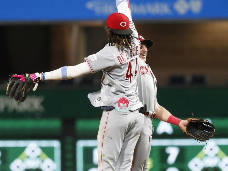 Aug 13, 2023; Pittsburgh, PA, USA; Cincinnati Reds shortstop Elly De La Cruz (44) and outfielder Spencer Steer celebrate after defeating the Pittsburgh Pirates at PNC Park. The Reds won 6-5 in ten innings. Mandatory Credit: Charles LeClaire-USA TODAY Sports