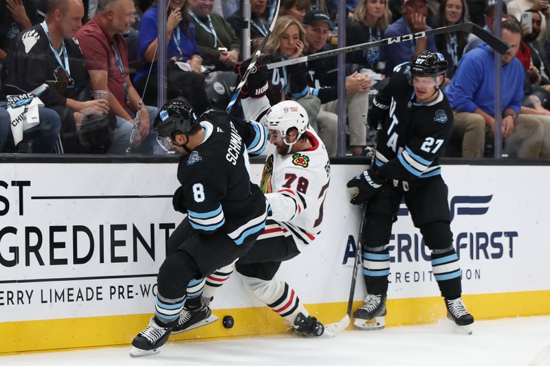 Oct 8, 2024; Salt Lake City, Utah, USA; Chicago Blackhawks defenseman TJ Brodie (78) battles with Utah Hockey Club forward Nick Shmaltz (8) and forward Barrett Hayton (27) during the third period at Delta Center. Mandatory Credit: Rob Gray-Imagn Images