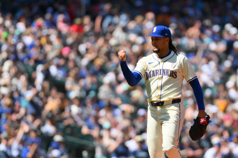 May 12, 2024; Seattle, Washington, USA; Seattle Mariners starting pitcher Luis Castillo (58) celebrates the final out against the Oakland Athletics during the sixth inning at T-Mobile Park. Mandatory Credit: Steven Bisig-USA TODAY Sports