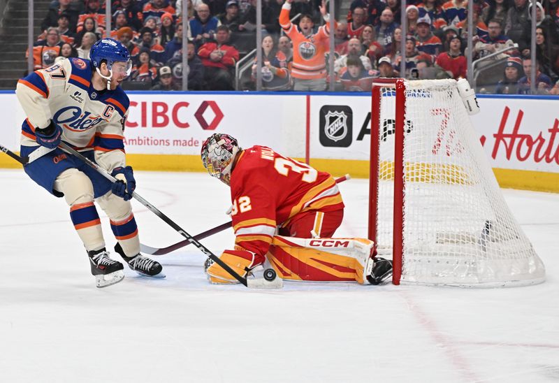 Dec 23, 2025; Edmonton, Alberta, CAN; Edmonton Oilers center Connor McDavid (97) goes in for a shot on Calgary Flames goalie Dustin Wolf (32) during the first period at Rogers Place. Mandatory Credit: Walter Tychnowicz-Imagn Images