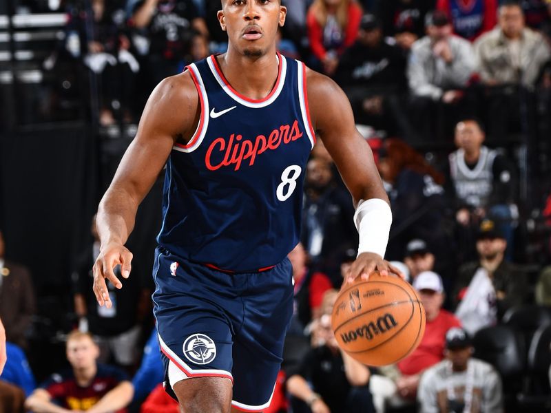 INGLEWOOD, CA - APRIL 26:  Kris Dunn #8 of the LA Clippers dribbles the ball during Round One, Game Four of the 2025 NBA Playoffs against the Denver Nuggets on April 26, 2025 at Intuit Dome in Los Angeles, California. NOTE TO USER: User expressly acknowledges and agrees that, by downloading and/or using this Photograph, user is consenting to the terms and conditions of the Getty Images License Agreement. Mandatory Copyright Notice: Copyright 2025 NBAE (Photo by Juan Ocampo/NBAE via Getty Images)