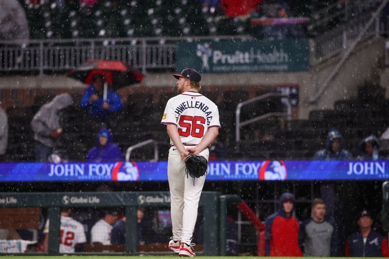 Apr 10, 2025; Atlanta, Georgia, USA; Atlanta Braves starting pitcher Spencer Schwellenbach (56) walks off the field against the Philadelphia Phillies during a rain delay in the seventh inning at Truist Park. Mandatory Credit: Brett Davis-Imagn Images
