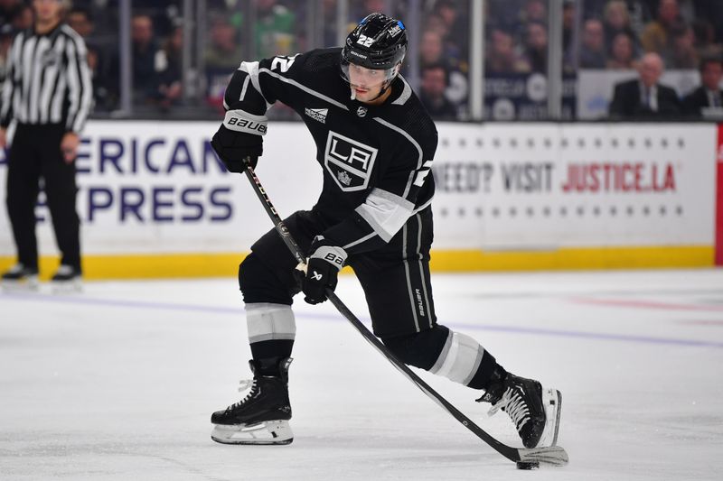 Mar 11, 2024; Los Angeles, California, USA; Los Angeles Kings left wing Kevin Fiala (22) shoots on goal against the New York Islanders during the second period at Crypto.com Arena. Mandatory Credit: Gary A. Vasquez-USA TODAY Sports